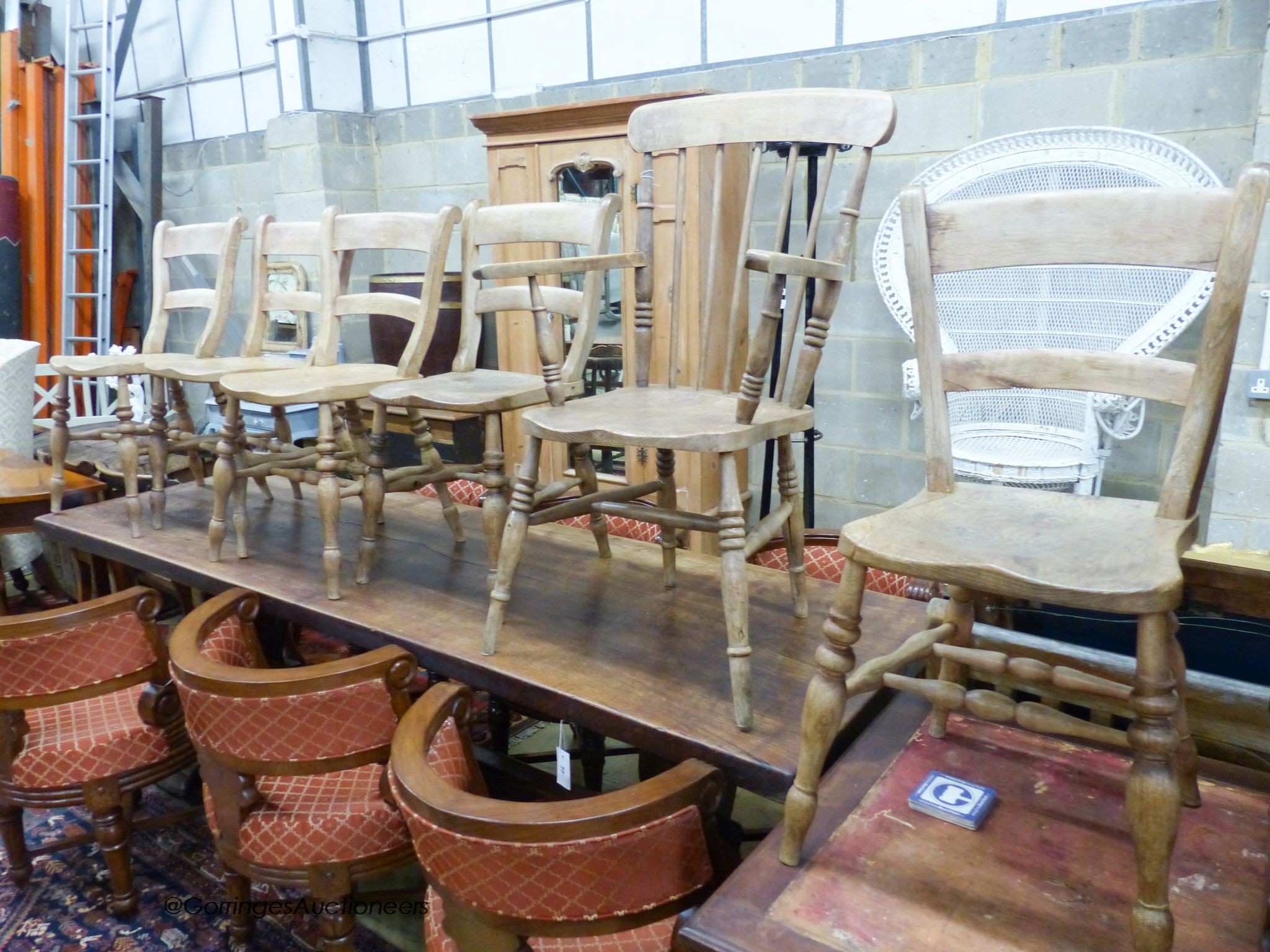 A Victorian elm and beech Windsor elbow chair togehter with five Victorian Windsor kitchen chairs